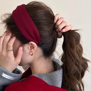 Retro wide burgundy fabric headband for women shown on a model with elegant styling
