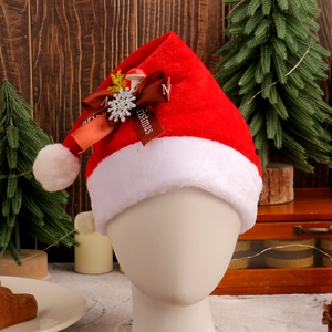 Red plush Christmas hat with silver snowflakes and mushroom decor on a mannequin