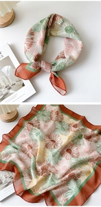 Detail of floral linen-cotton square scarf showing chrysanthemum print and texture