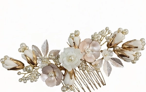 Detailed view of floral bridal hair comb with pearls and gold ceramic flowers