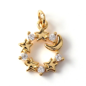 Detail of gold moon and star pendant with sparkling clear crystals for DIY jewelry