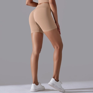 Detail view of seamless nude high-waisted fitness shorts with premium compression fabric