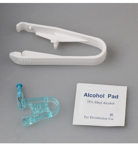 Disposable ear piercing gun kit with sterile alcohol pad and safety piercing tool