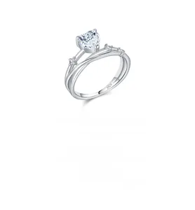 Macro detail showing S925 hallmark on heart-shaped moissanite silver ring band