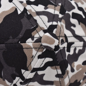 Close-up of camouflage baseball cap crown showing canvas texture and stitching
