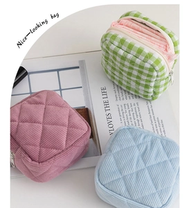 Three quilted corduroy pouches in plaid and lilac patterns for sanitary napkin storage