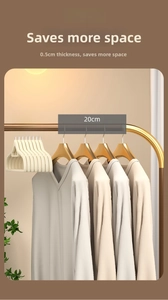 Space-saving 0.5cm slim beige flocked hangers with gold hooks in wardrobe comparison