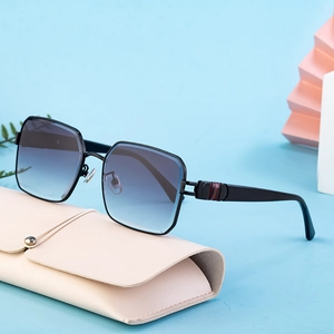 Chic oversized square sunglasses with black frames and gradient lenses on a leather case