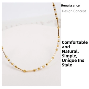 Detailed close-up of a vintage gold-plated necklace featuring white pearls and spiral beads