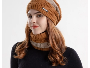 Detail shot of winter knitted beanie and neck warmer set in brown and beige stripes