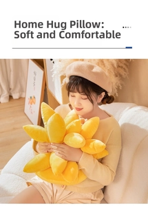 Woman holding a soft yellow sunflower plush pillow in a cozy home setting