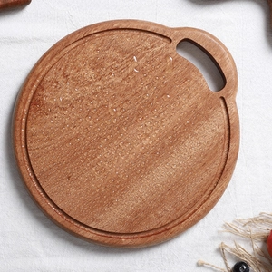 Round ebony wood cutting board with water droplets and handle hole for kitchen use