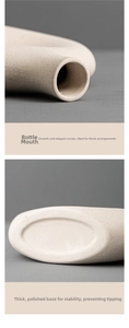Detail of minimalist cream ceramic vase showing smooth rim and sturdy flat base