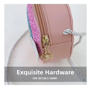 Detailed close-up of girls' pink crossbody bag showing gold petal zipper and glitter accents