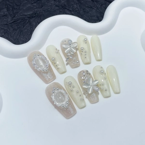 Luxury handmade press-on nails with cat-eye stones, pearls, and 3D butterfly charms