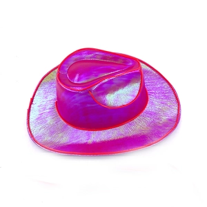 Detail of holographic rose pink cowboy hat with reflective laser finish and red trim edge