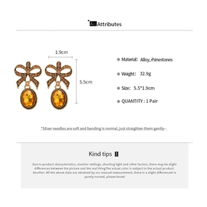 Detailed dimensions and specifications for the vintage bow earrings with amber crystals