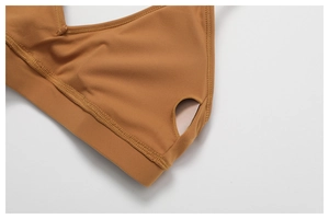 Macro detail of side pocket for removable chest pads on a quick-dry yoga sports bra
