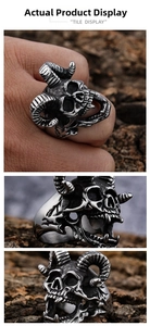 Macro detail of punk rock goat head skull ring with vintage distressed silver finish