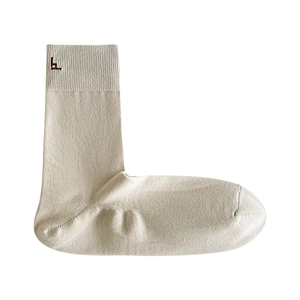 Beige mid-calf cotton business sock with ribbed cuff and logo in 90-degree L-shape view