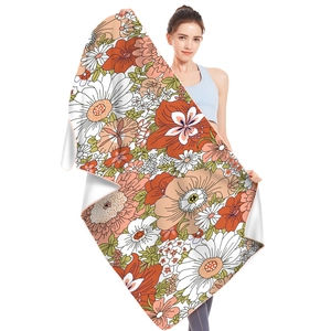 Microfiber beach towel with vintage floral pattern held by a model on white background