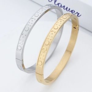 Polished stainless steel sun moon star bangle set in gold and silver finish