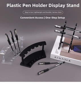 Clear acrylic pen holder rack displaying various markers on a neutral background