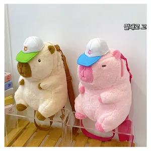 Detail view of cream and pink Capybara plush backpacks with cute hats and zipper closure