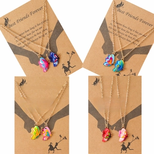 Enamel butterfly friendship necklace set in four vibrant colors with gold chains