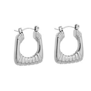 Detail shot of silver square-shaped chunky hoop earrings with spiral ribbed texture