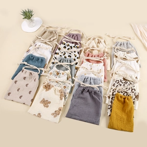 Multi-pattern muslin cotton drawstring storage bags for baby items in various colors