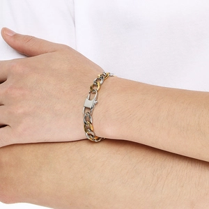 Detailed close-up of a 9mm two-tone gold and silver stainless steel chain bracelet