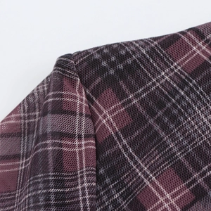 Close-up of the burgundy plaid pattern and sheer mesh texture on the retro maxi dress