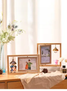 Close-up of double-sided rotating wooden photo frame with creative decorative lighting