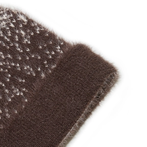 Close-up of brown faux mink knitted hat showing jacquard pattern and plush fiber texture