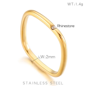 Minimalist square gold stainless steel ring with small rhinestone on white background