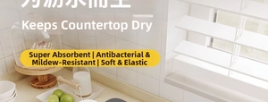 Detail of grey absorbent kitchen mat showing soft texture and high water absorption capacity