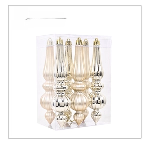 Detail of champagne Christmas pendant ornaments with vertical ridges in a clear gift box