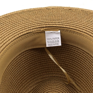Neutral straw sun hat with 100% paper material label and inner weave detail