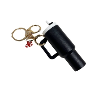 Miniature Stanley style black cup keychain with a red Christmas stocking pendant and gold clip