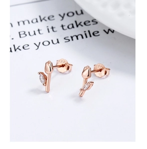 Macro detail of rose gold S925 sterling silver tulip earrings with marquise cubic zirconia