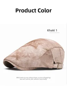Detail view of khaki newsboy cap with vintage tie-dye texture and adjustable metal buckle