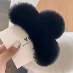 Elegant large black faux rabbit fur shark clip with a soft plush texture for women
