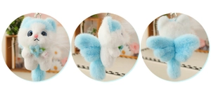 Plush angel cat keychain showing front, side and back views with blue wings and a flower