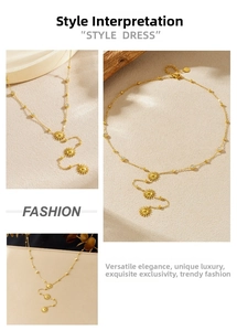 Detail view of gold sunflower pendant necklace with sparkling diamonds and fringe chain