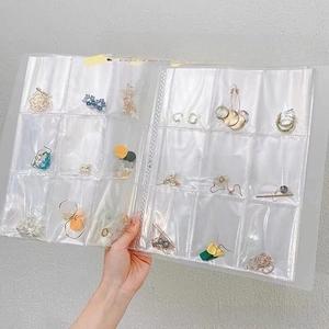 Transparent PVC storage page with multiple compartments for earrings and jewelry organizing