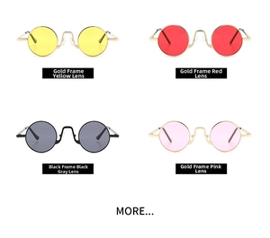 Macro display of retro small round sunglasses in gold and black metal frames