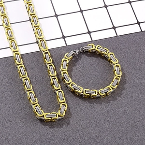 Detailed view of 8mm gold and silver two-tone Byzantine chain necklace and bracelet set