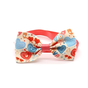 Detailed macro view of heart pattern and LOVE lettering on colorful pet bow tie