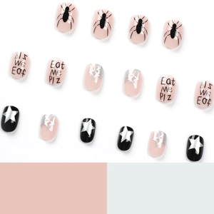 Short round Halloween press-on nails with spider patterns and 'Eat Me Plz' print